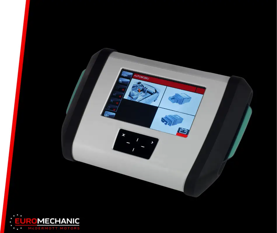 A handheld automotive diagnostic device with a color touchscreen displaying mechanical diagrams, perfect for car checkups in Toronto. The device features a simple control pad below the screen, and the brand name EUROMECHANIC with logo is in the bottom left corner. EuroMechanic | McDermott Motors Auto | Top Reviewed Auto Repair Shop in Toronto | Visit mcdermottmotors.com