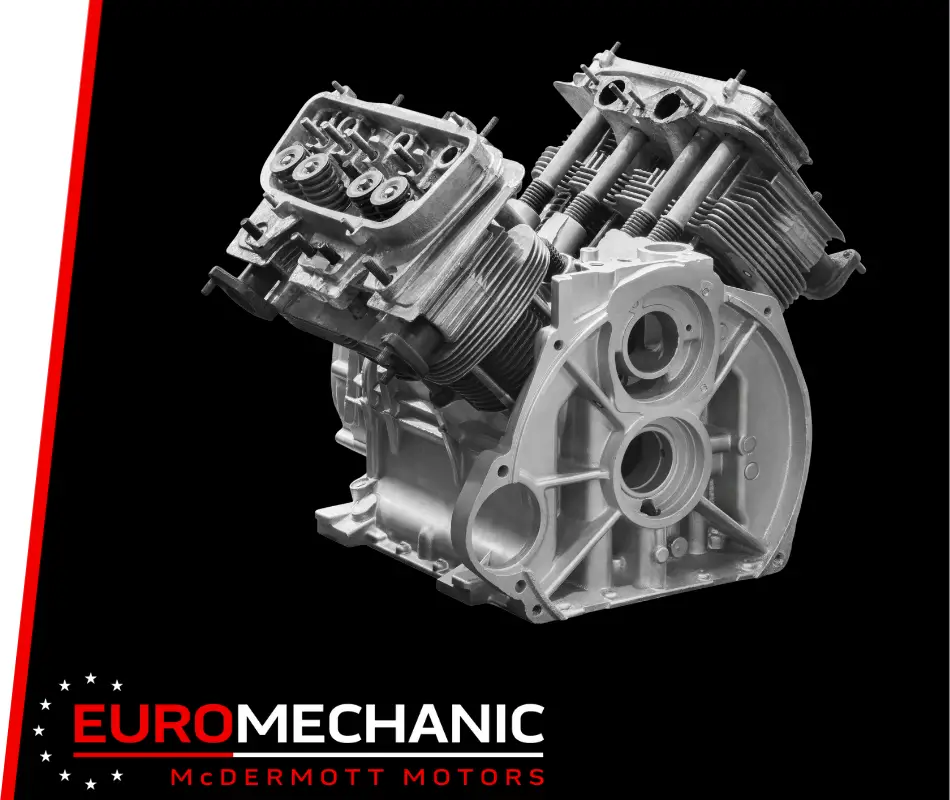 Black and white image of a car engine displayed on a black background, showcasing visible pistons and mechanical components. In the bottom left corner, the EuroMechanic McDermott Motors logo in red and white proudly signifies top-notch engine repair in Toronto. EuroMechanic | McDermott Motors Auto | Top Reviewed Auto Repair Shop in Toronto | Visit mcdermottmotors.com