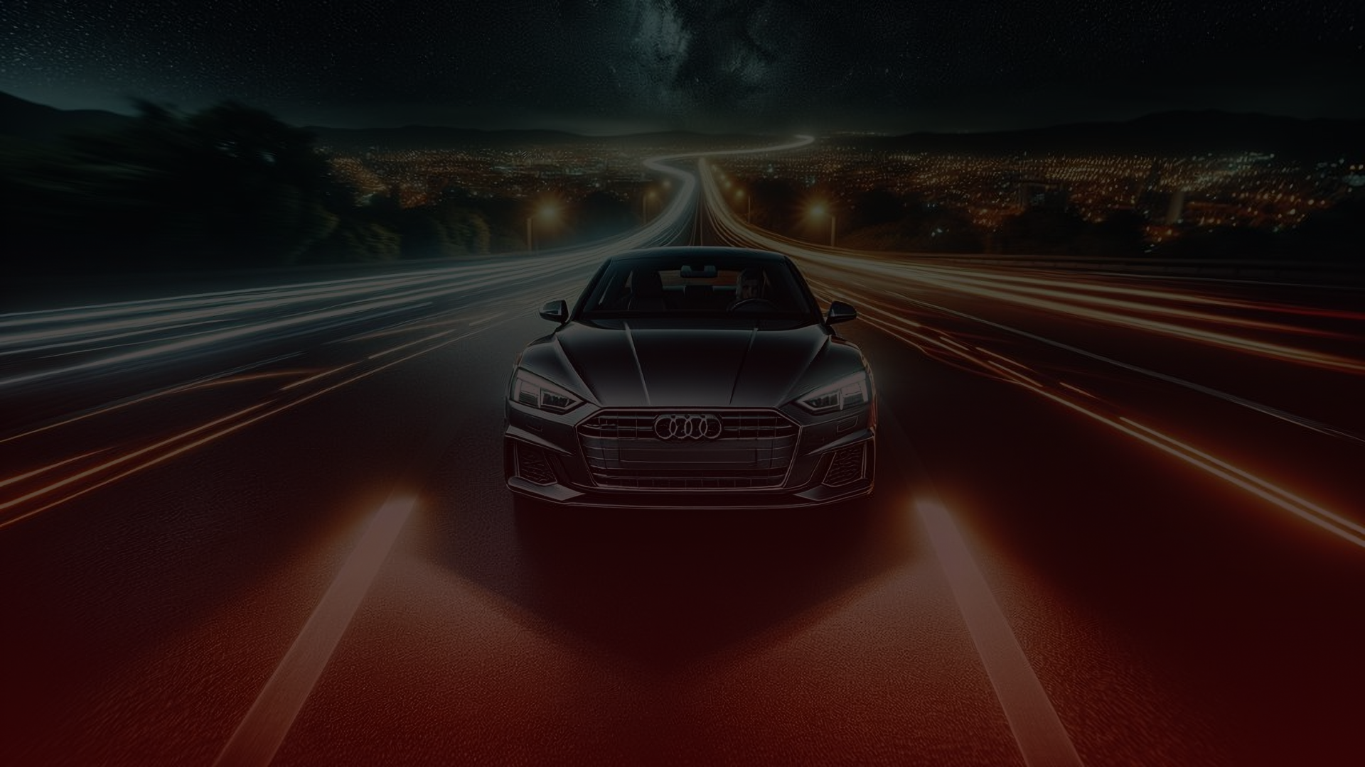 A sleek Audi cruises down the highway at night, its headlights creating streaks of light with a long exposure effect. City lights glow in the background under a starry sky, reminiscent of adventures waiting beyond each horizon—Torontos finest mechanics ensure its running flawlessly. EuroMechanic | McDermott Motors Auto | Top Reviewed Auto Repair Shop in Toronto | Visit mcdermottmotors.com