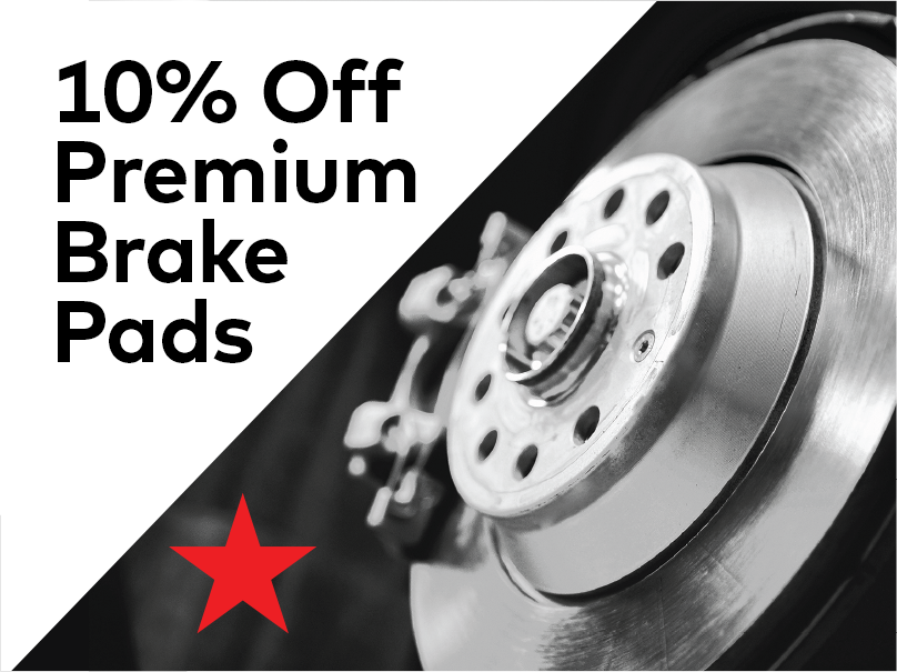 Close-up image of a brake disc with text overlay reading 10% Off Premium Brake Pads in bold black letters on a white background. A red star is located at the bottom left corner. EuroMechanic | McDermott Motors Auto | Top Reviewed Auto Repair Shop in Toronto | Visit mcdermottmotors.com